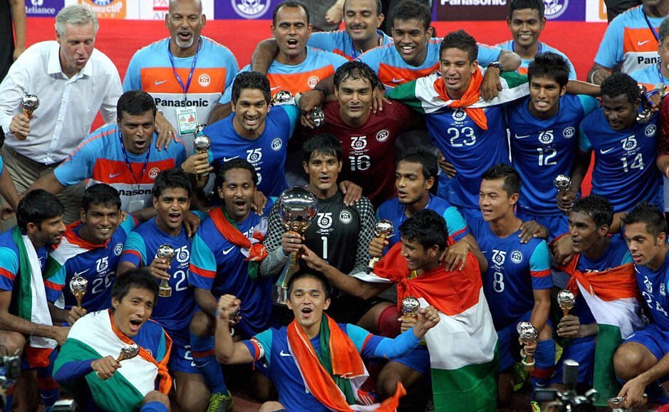Gouramangi Singh and the India national football team celebrating a Nehru Cup title, marked with the AIFF's 75th-anniversary crest