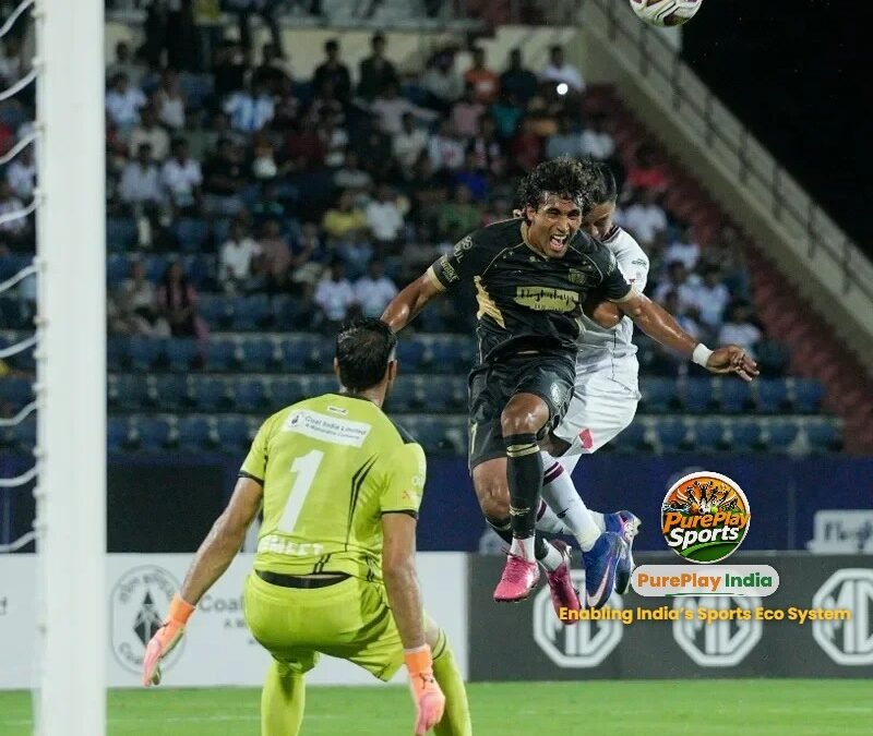 NorthEast United FC player wins a header in the box against Mohun Bagan Super Giant