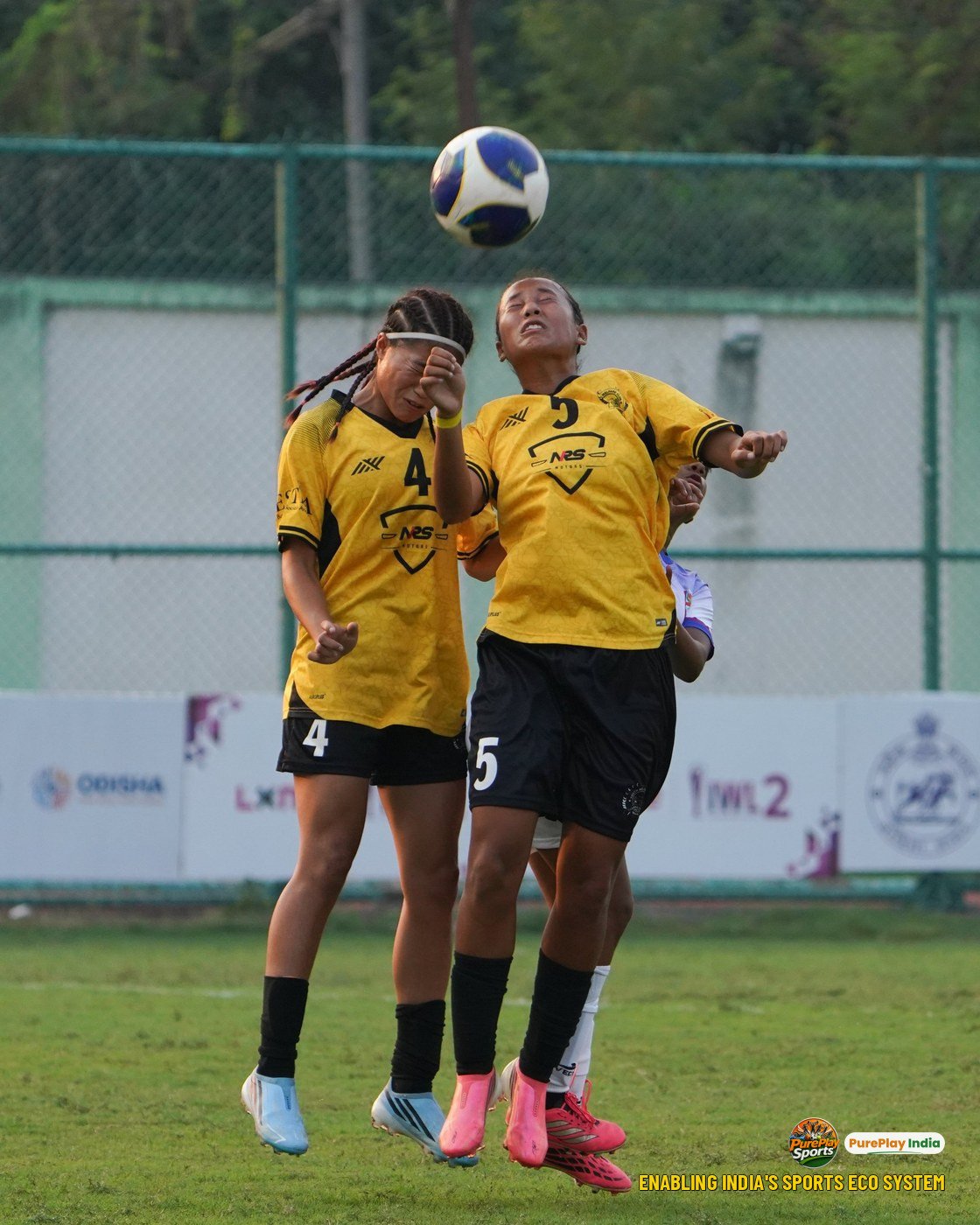 YWC, Manipur defenders Mathoi and Joyshini rise together to head the ball clear